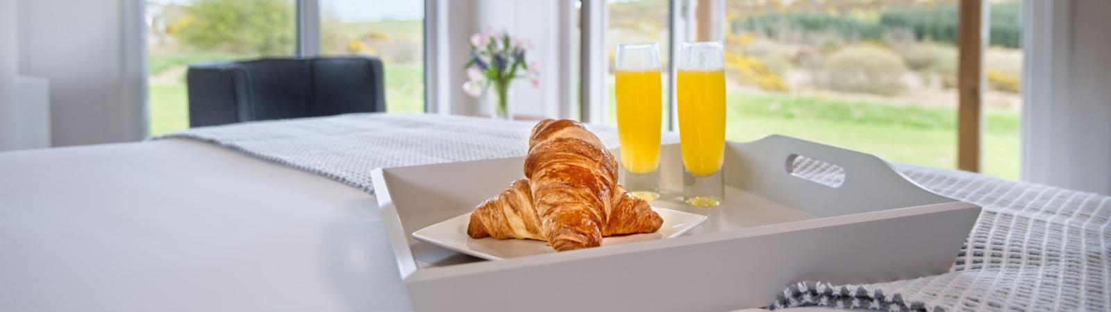 bed with croissants